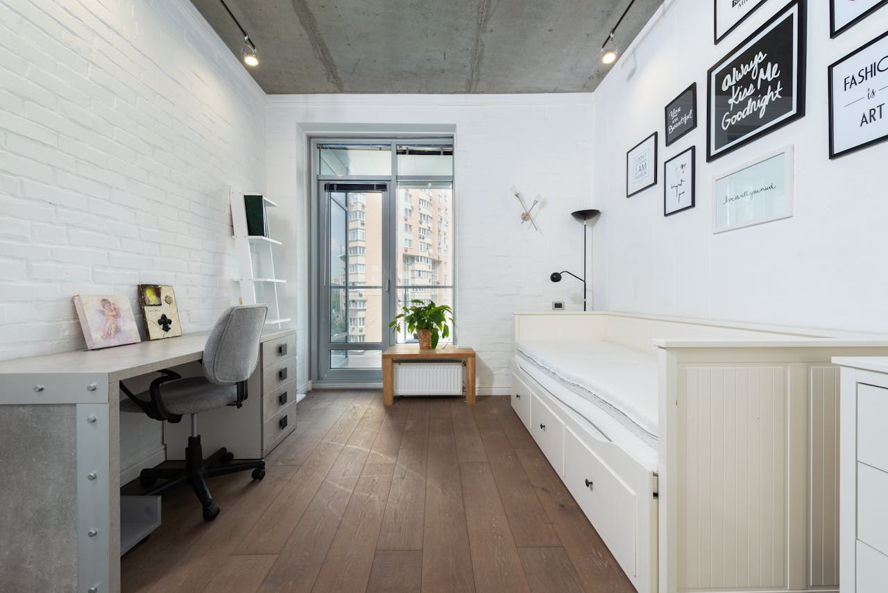 Bright, minimalist bedroom with contemporary decor and stylish furnishings.